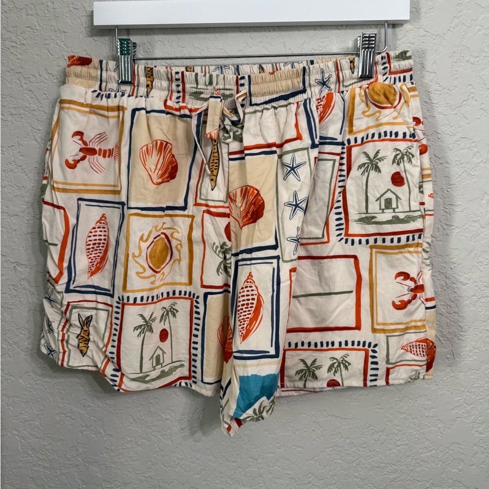 Petal & Pup Cream Shorts with Orange & Blue Beach Motif